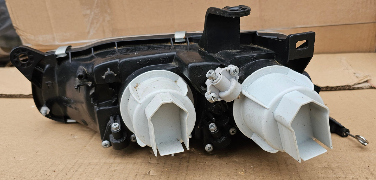 Žaromet sprednji desni-Mazda 323F (novo)