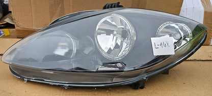 Žaromet sprednji levi-Seat Leon (poškodovan zgornji nosilec)